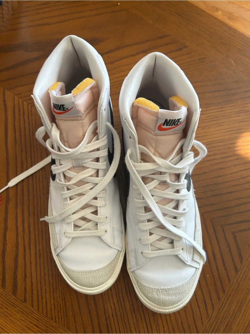 Nike High-Top Sneakers in White with Black Swoosh